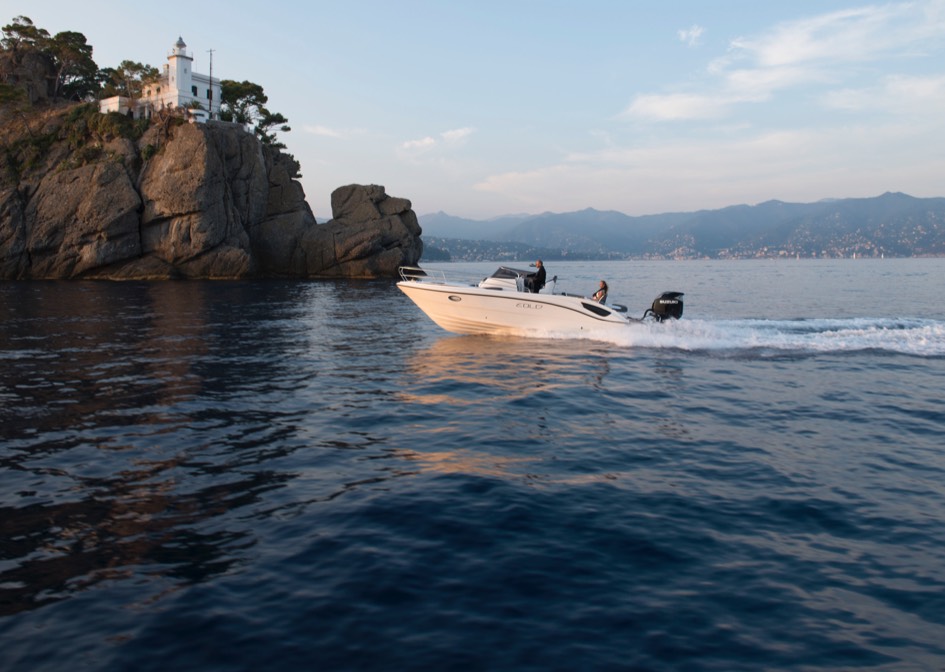 first four stroke outboard over 300 horsepower anchored on a small white boat